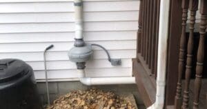 radon mitigation fan installed on the exterior wall